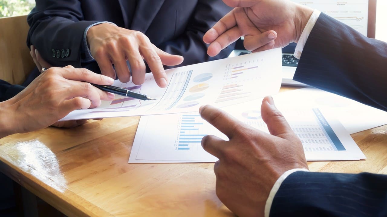 Performance reports and data charts on a meeting table